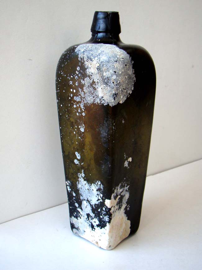 An 18th century Dutch square case gin bottle recovered from a shipwreck